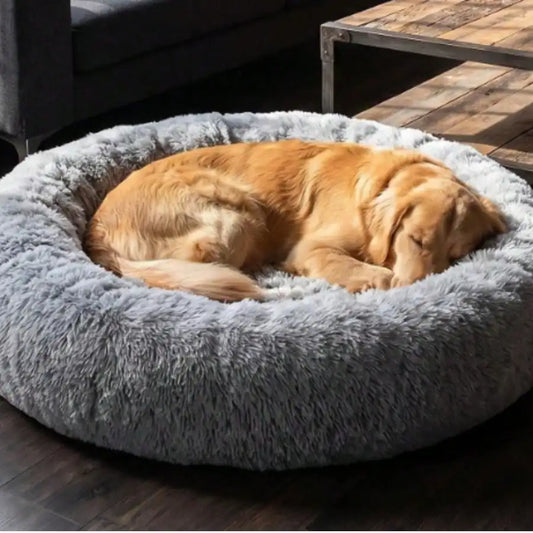 Soft calming donut bed reduces anxiety and provides cozy comfort.