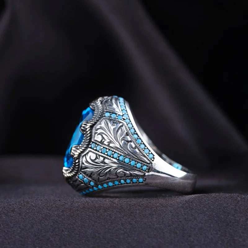 Retro handmade Turkish men's ring with blue zircon, vintage silver punk style.